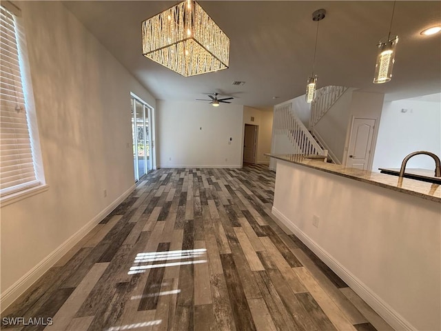 interior space with sink, dark hardwood / wood-style flooring, and ceiling fan