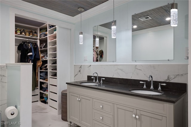 bathroom featuring ornamental molding, wood ceiling, backsplash, and vanity