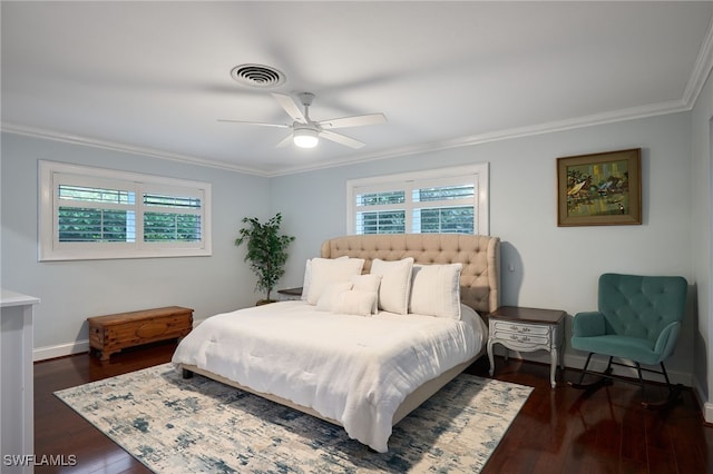 bedroom featuring dark wood-type flooring, ceiling fan, and ornamental molding