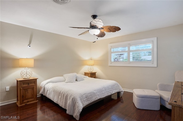 bedroom featuring dark hardwood / wood-style flooring and ceiling fan