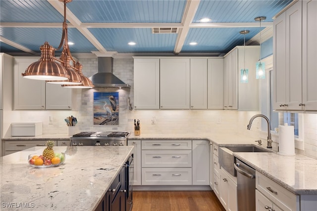 kitchen with hanging light fixtures, sink, light stone counters, dishwasher, and coffered ceiling