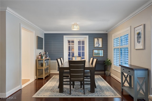 dining space featuring french doors, dark hardwood / wood-style floors, and ornamental molding