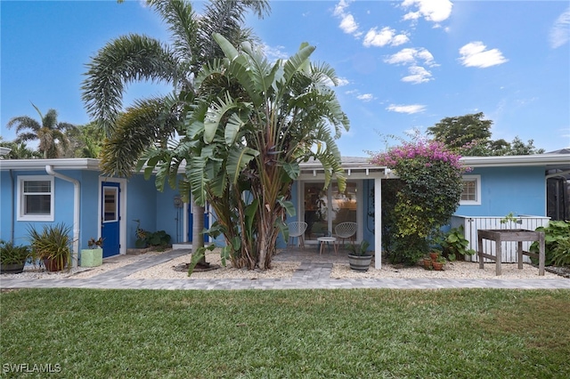 exterior space featuring a front lawn