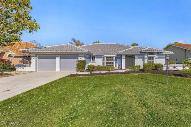 view of front facade with a garage and a front lawn