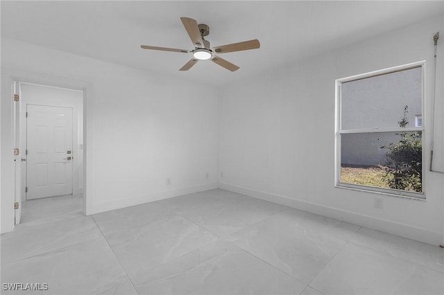 spare room with ceiling fan