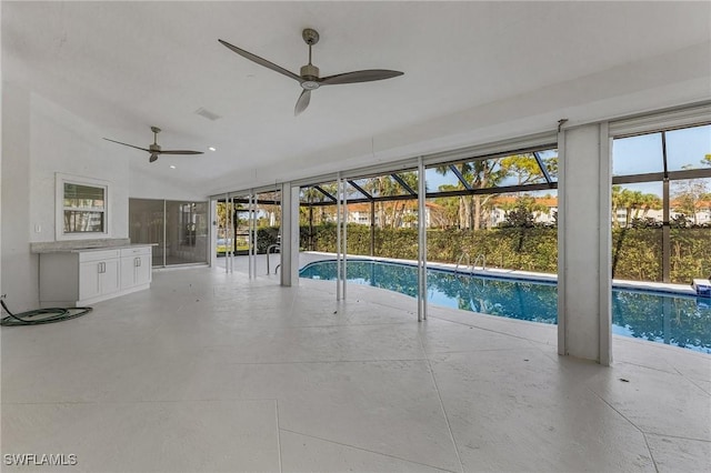 view of swimming pool with ceiling fan