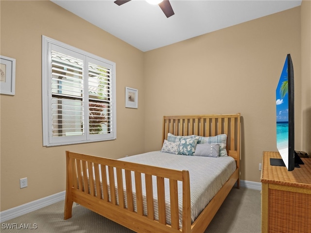 bedroom with ceiling fan and carpet