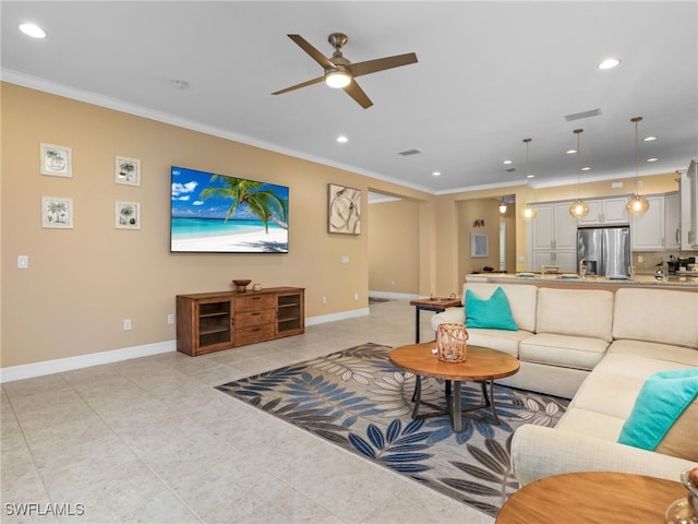 tiled living room with ceiling fan and crown molding