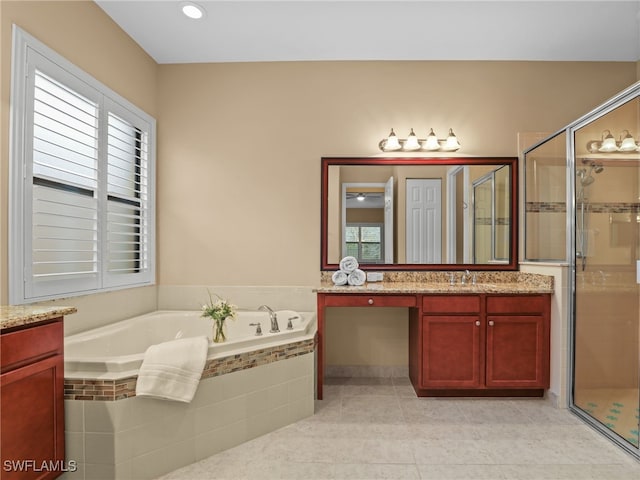 bathroom featuring independent shower and bath, tile patterned flooring, and vanity