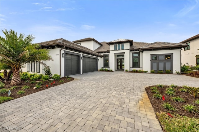 prairie-style house featuring a garage