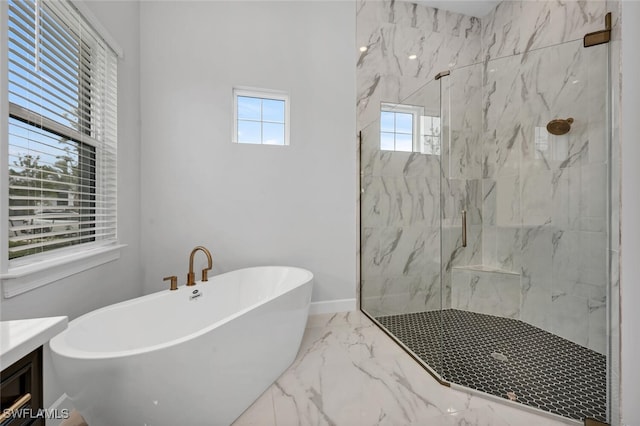 full bath with a marble finish shower, baseboards, a soaking tub, marble finish floor, and vanity