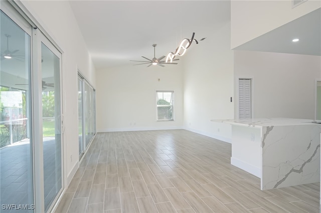 unfurnished living room featuring ceiling fan