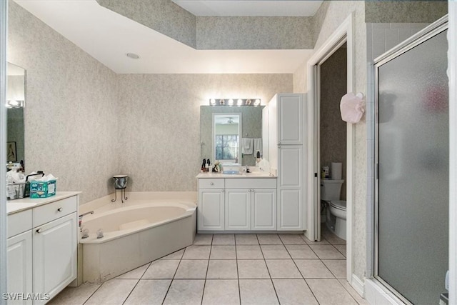 full bathroom with tile patterned floors, toilet, independent shower and bath, and vanity