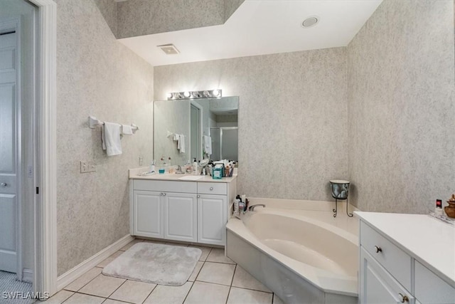 bathroom with tile patterned floors, separate shower and tub, and vanity