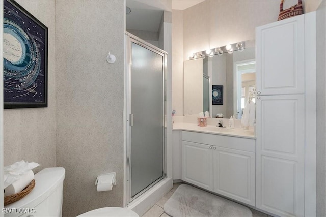 bathroom with vanity, an enclosed shower, tile patterned floors, and toilet