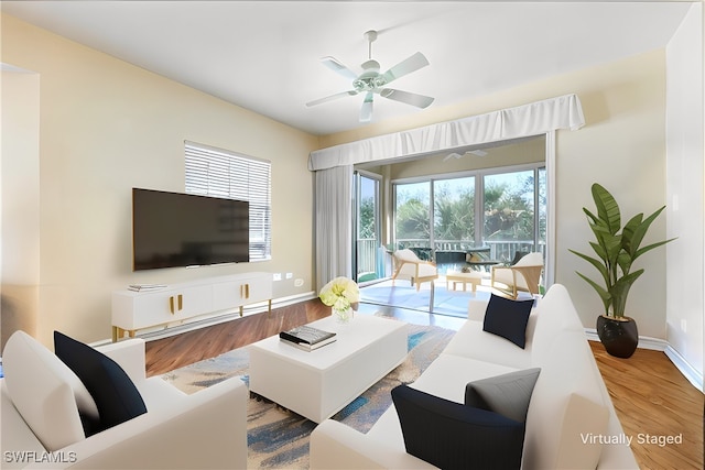 780 Bentwater Cir Unit 201, Naples, FL 34108 - living room featuring wood finished floors, ceiling fan, and baseboards