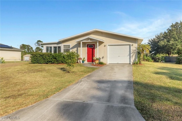 single story home with a garage and a front yard