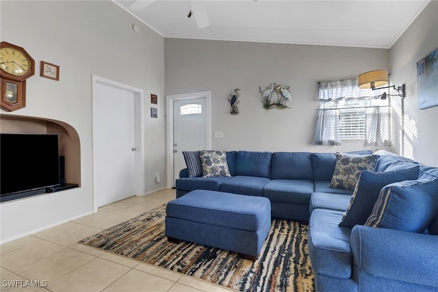 living room with crown molding, tile patterned floors, and ceiling fan