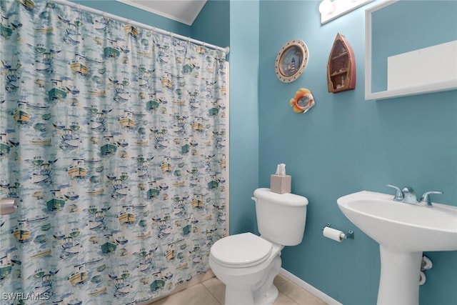 bathroom featuring tile patterned flooring, sink, and toilet