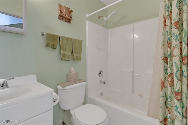 full bathroom with vanity, shower / tub combo with curtain, and toilet