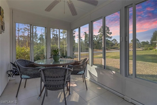 sunroom featuring a wealth of natural light and ceiling fan