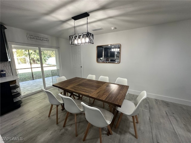 dining area with light hardwood / wood-style flooring