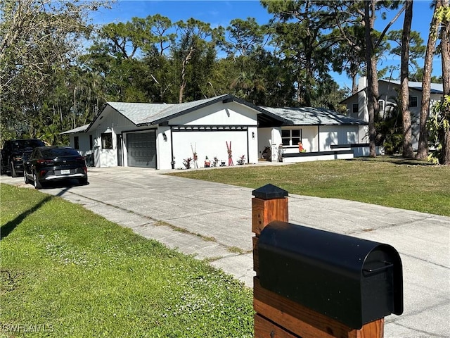 view of front facade featuring a front lawn and a garage