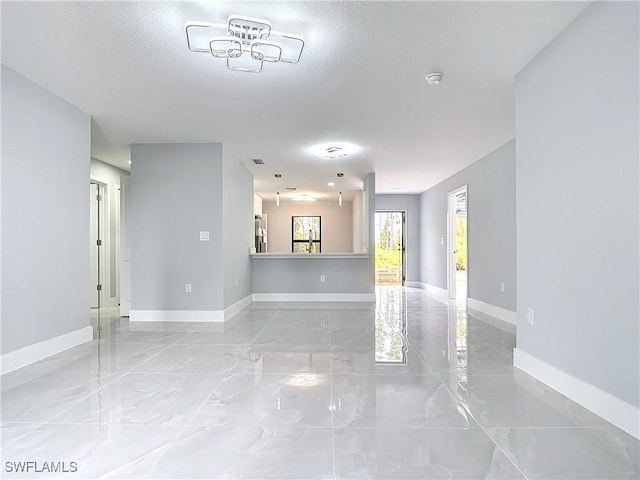 unfurnished living room featuring a textured ceiling