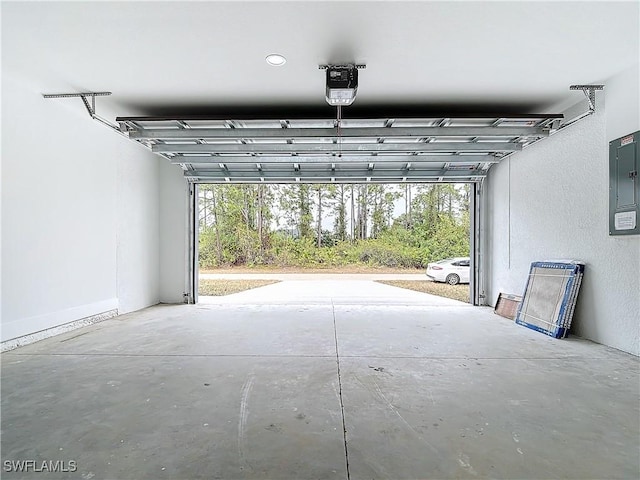 garage featuring a garage door opener and electric panel