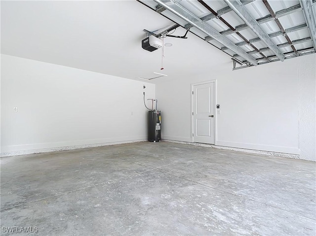 garage featuring a garage door opener and water heater