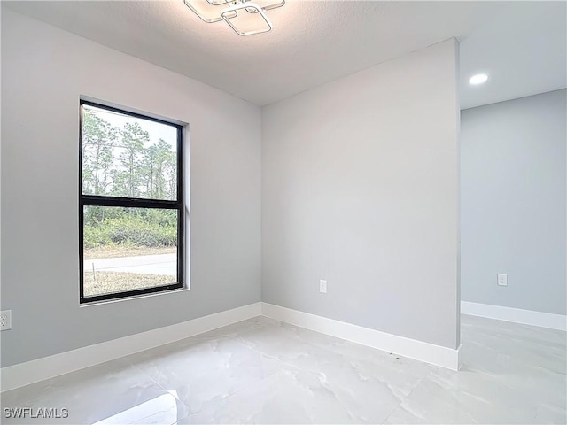 empty room with a textured ceiling