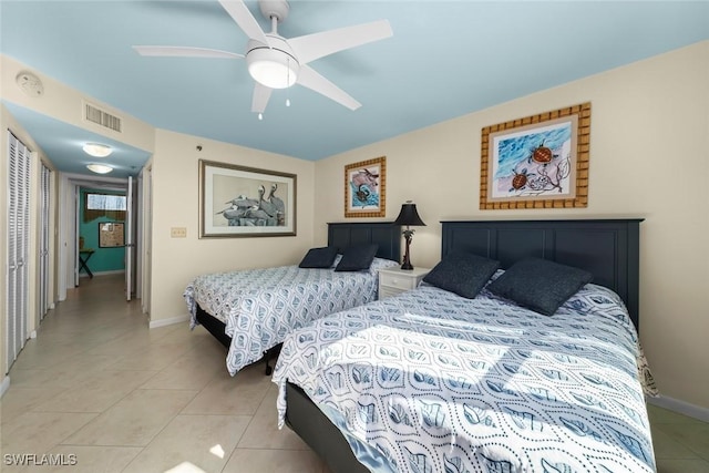 bedroom featuring ceiling fan and light tile patterned floors