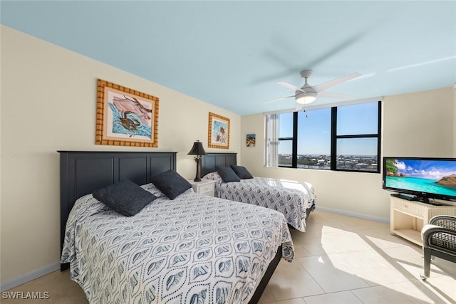 bedroom featuring ceiling fan and light tile patterned floors