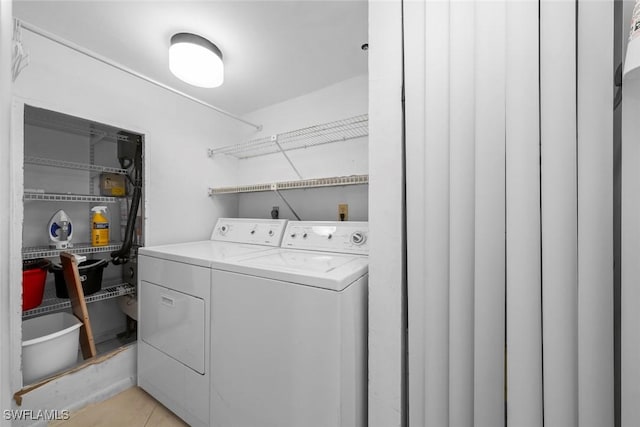 laundry area with independent washer and dryer