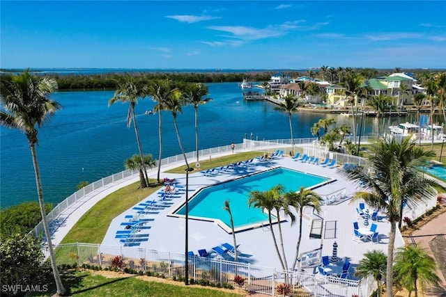 view of swimming pool featuring a patio area and a water view