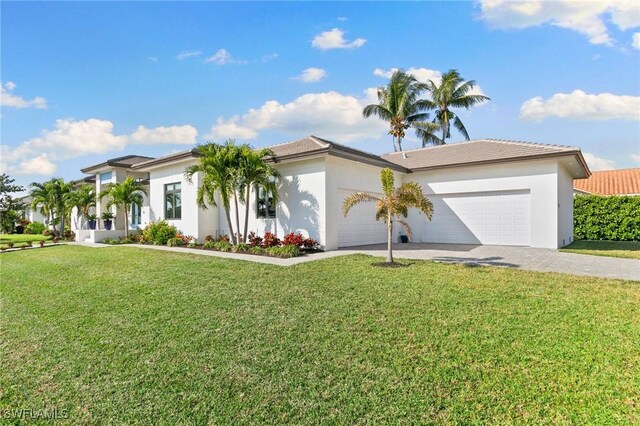 view of front facade with a front lawn and a garage