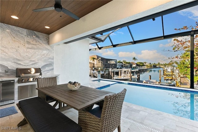 100 Templewood Ct, Marco Island, FL 34145 - view of pool featuring grilling area, a ceiling fan, and a water view