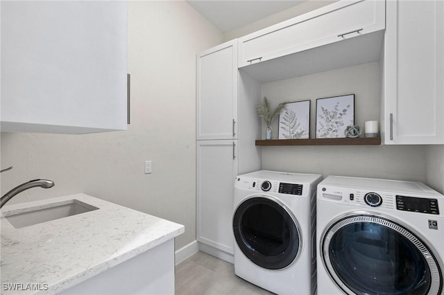 100 Templewood Ct, Marco Island, FL 34145 - laundry area featuring cabinet space, washer and clothes dryer, and baseboards