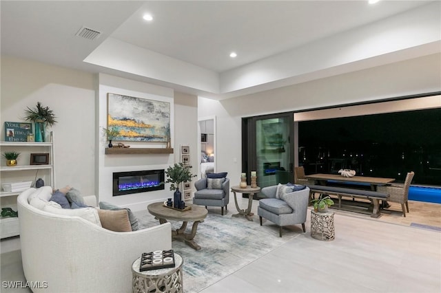 100 Templewood Ct, Marco Island, FL 34145 - living room featuring a glass covered fireplace, wood finished floors, and recessed lighting