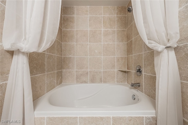 bathroom featuring shower / bath combo with shower curtain