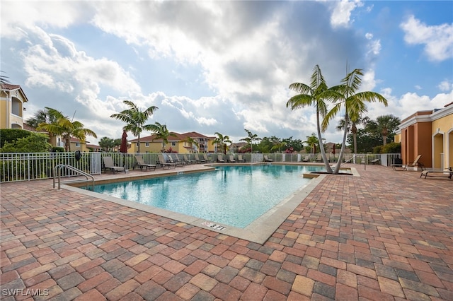 view of swimming pool with a patio area