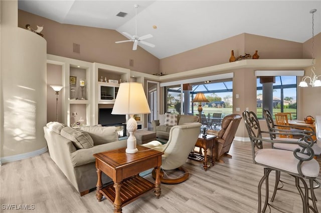 living room with ceiling fan, built in features, light hardwood / wood-style flooring, and high vaulted ceiling