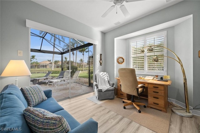 office space with ceiling fan and light hardwood / wood-style floors