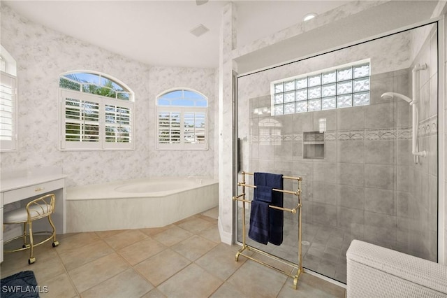 bathroom with a healthy amount of sunlight, tile patterned flooring, independent shower and bath, and radiator