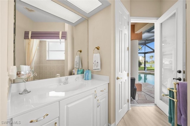 bathroom featuring vanity and hardwood / wood-style flooring