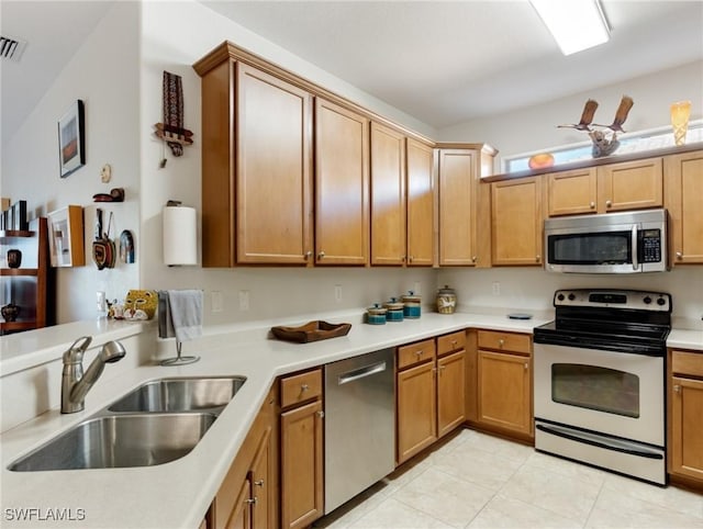 kitchen with sink and appliances with stainless steel finishes