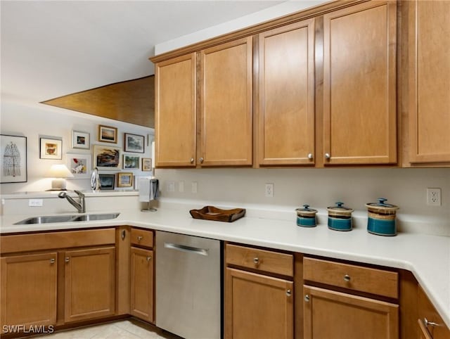 kitchen with stainless steel dishwasher, light tile patterned flooring, and sink