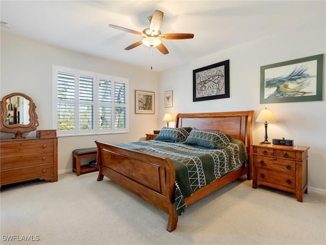 bedroom with ceiling fan and carpet