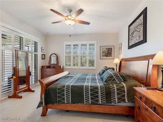 bedroom with ceiling fan and carpet