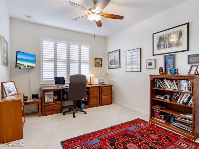 office with ceiling fan and light carpet